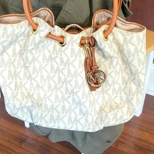 Micheal Kors tan and brown hobo bag. Excellent condition.